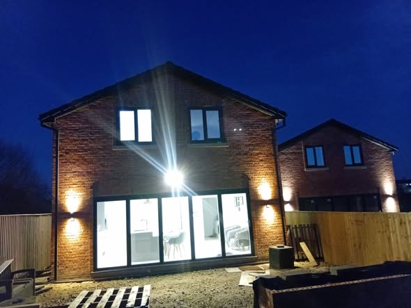 Completed brick new-build home in Bowlee Heywood with Renegade-installed external lighting