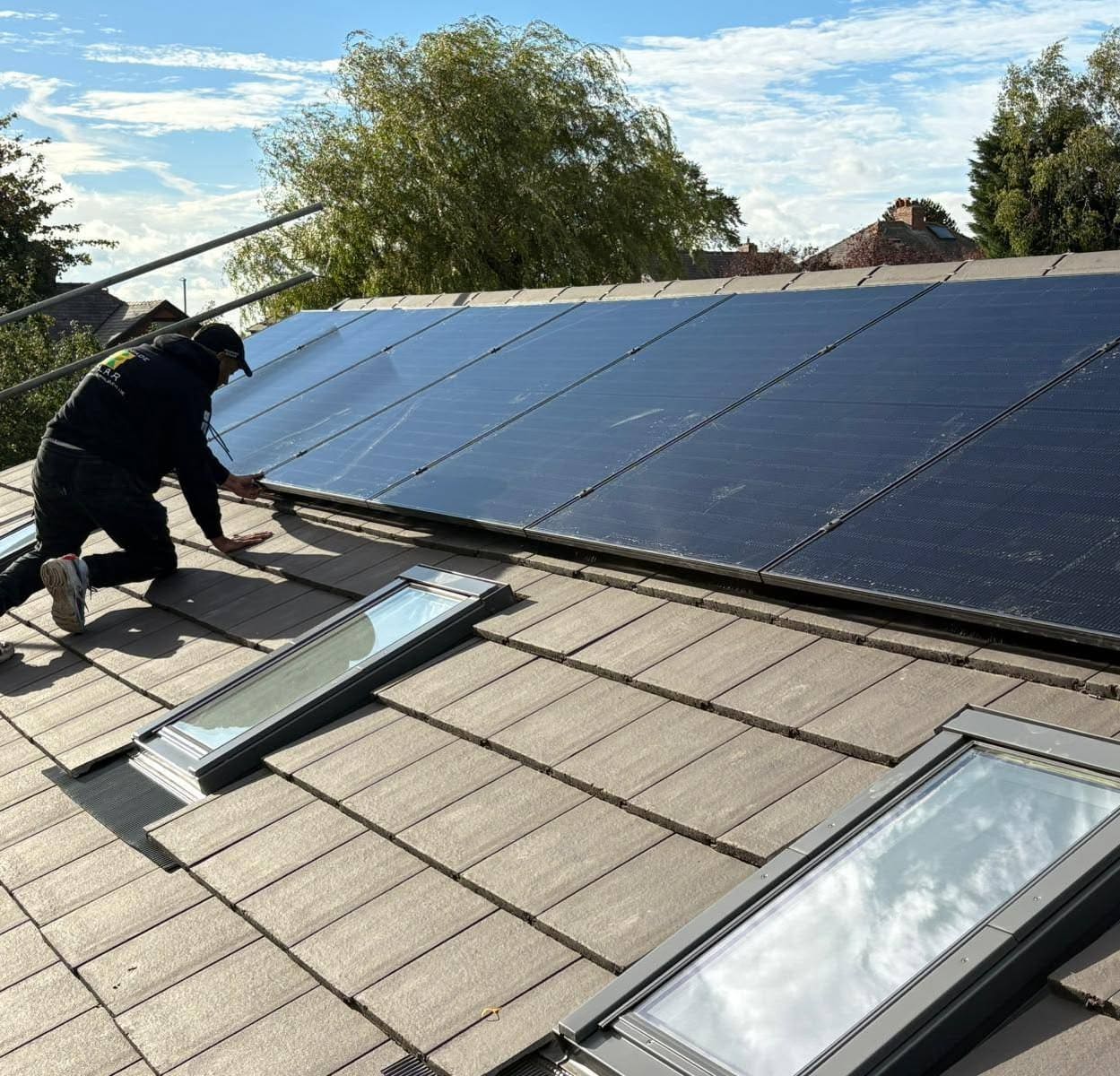 Renegade Solar panel installation fitted across a pitched roof above three rooflights