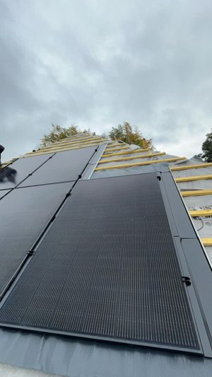 Solar panels being installed as part of a roof replacement