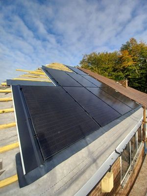 Solar panels being installed as part of a roof replacement