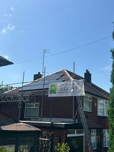 Solar panel installation on a tiled residential roof with scaffolding
