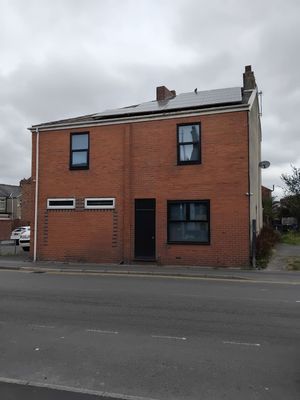 Completed solar panel installation on flat roof in Failsworth
