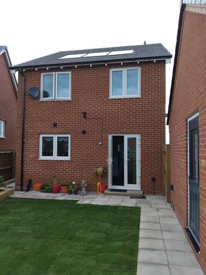 New build house with minimal solar panel installation on roof