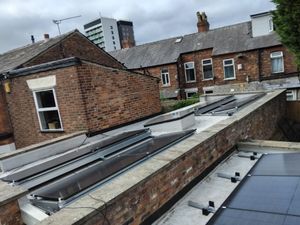 Solar panel mounting framework on flat concrete roof