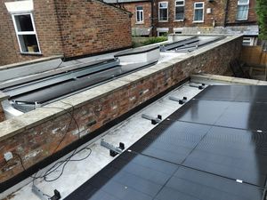 Completed flat roof solar panel array with proper alignment