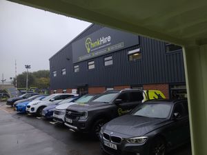 ThinkHire commercial building with electric vehicle fleet charging stations