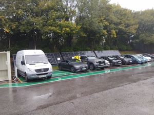 Solar canopy powering electric vehicle charging bays at commercial car park